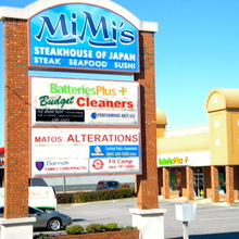 Matos Alterations listed on the Woodruff Road shopping center sign